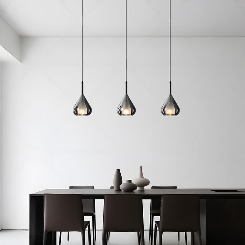 Modern glaspendel i vattendroppsdesign med LED och justerbar höjd