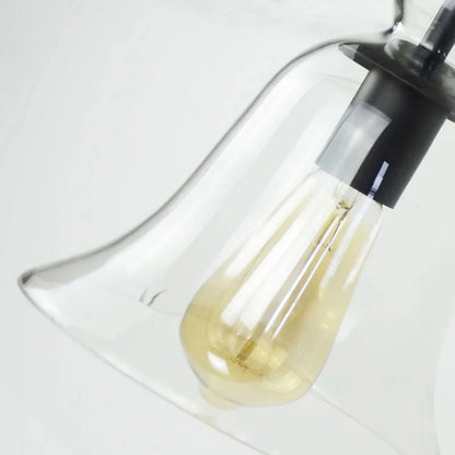 Glaspendel i klockform med svart metallfäste för kök och vardagsrum