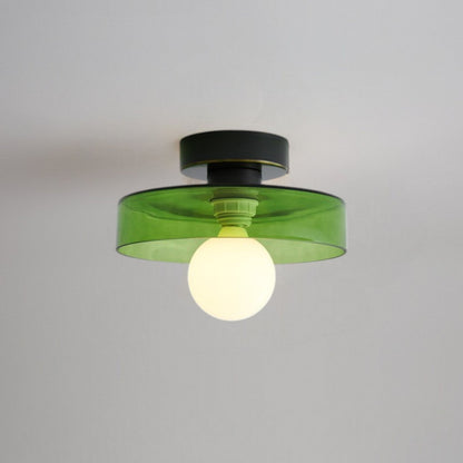 Modern rund taklampa i mässing och glas med geometrisk design
