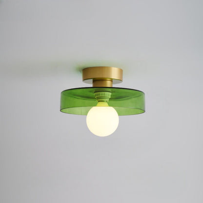 Modern rund taklampa i mässing och glas med geometrisk design