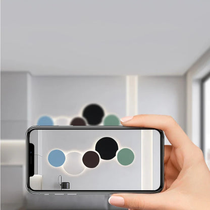 Minimalistisk LED-vägglampa i metall med cirkulär design