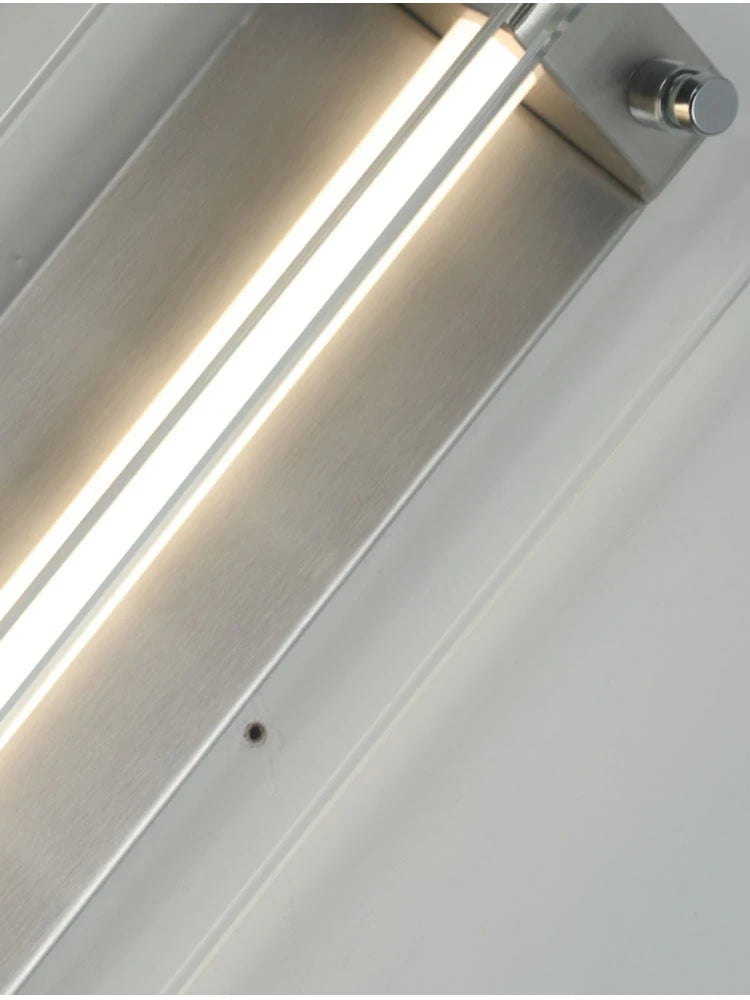 Vägglampa i glas med modern och antik design i rostfritt stål