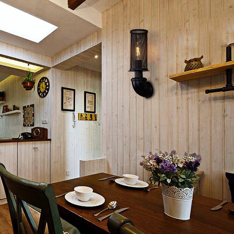 Modern industriell vägglampa i järn med rördesign