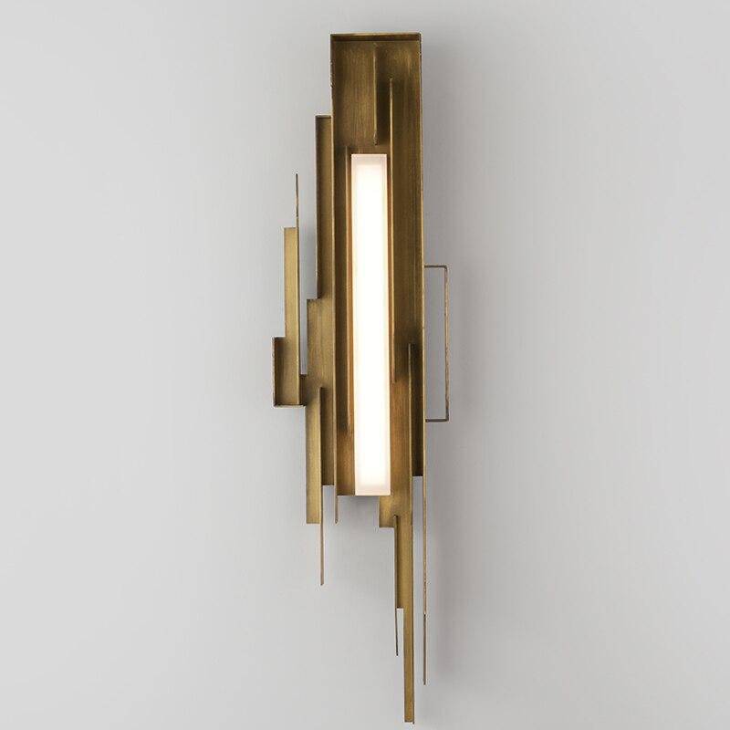 Elegant vägglampa i guld – konstnärlig design och exklusiv belysning